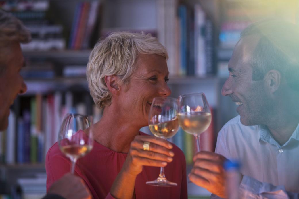 Older couple enjoying a drink at dinner