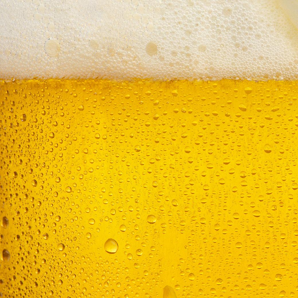 Close-up of golden beer foam
