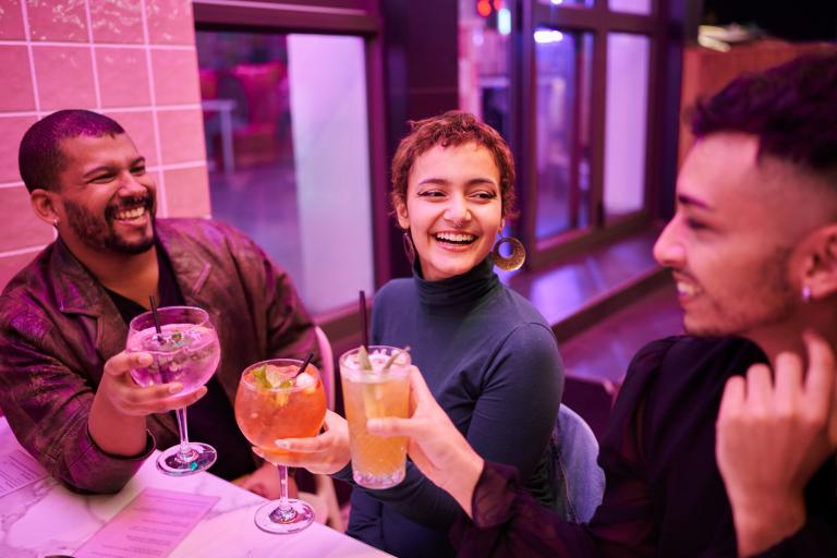 Friends smiling with drinks